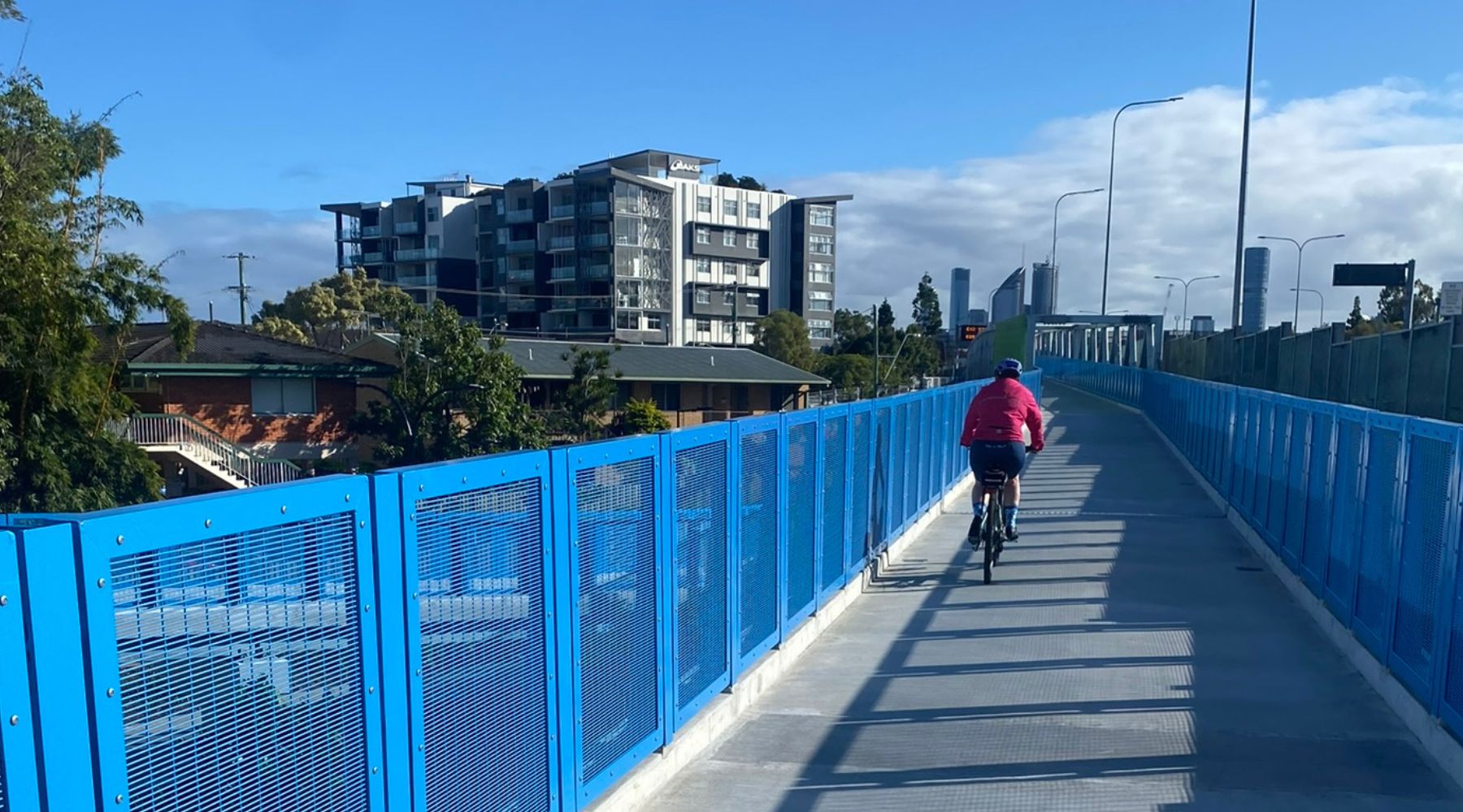 Cyclist riding across the Bridge near University of Queensland