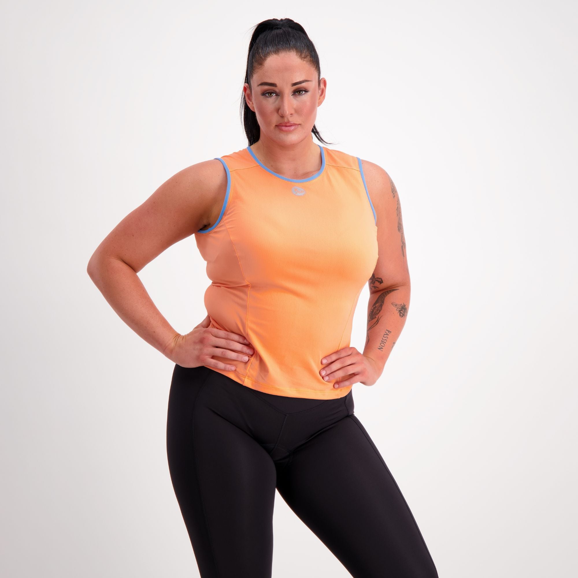 Sleeveless orange cycling base layer on model