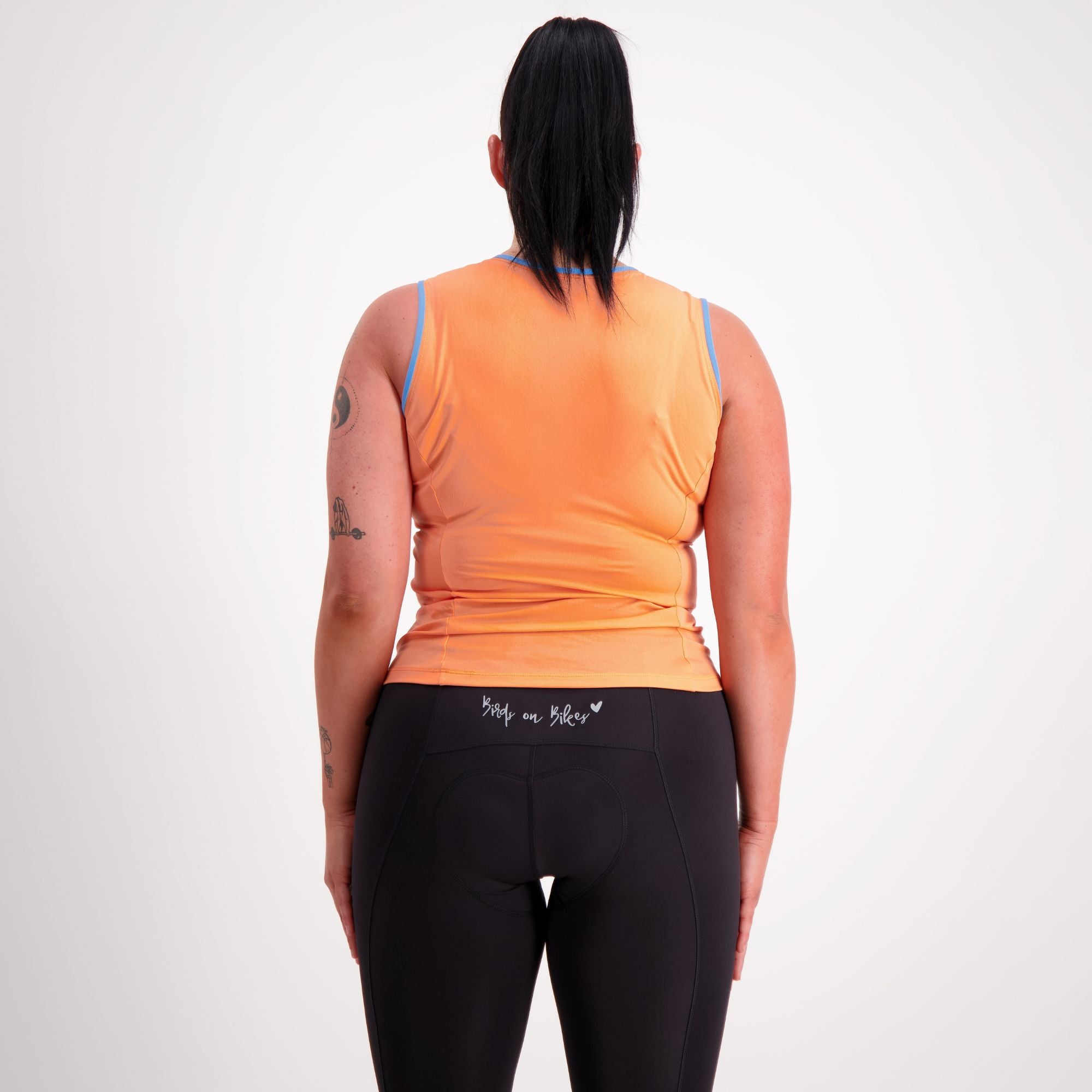 back view of sleeveless orange cycling base layer