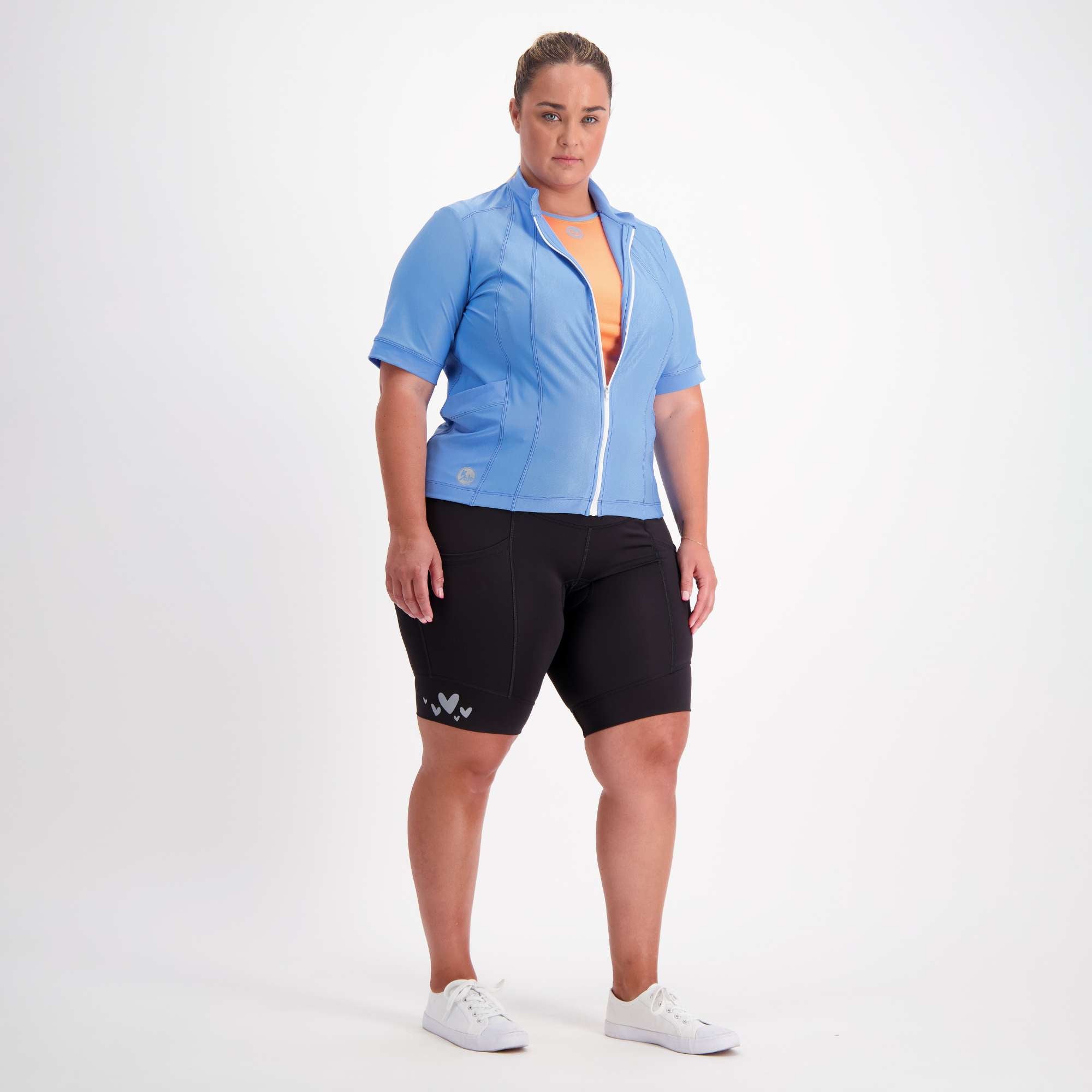 full body view of female model dressed in blue short sleeve cycling jersey