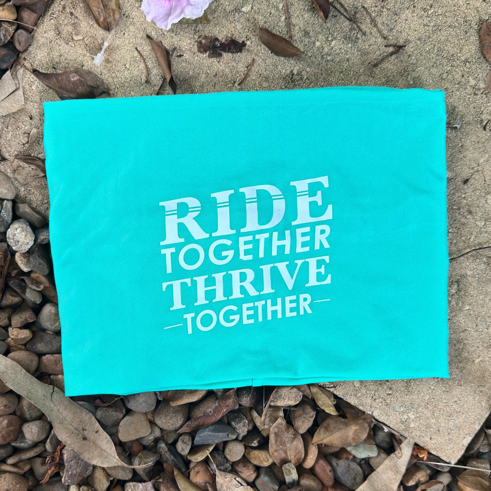 Flat lay of limited‑edition cycling snood showing print detail