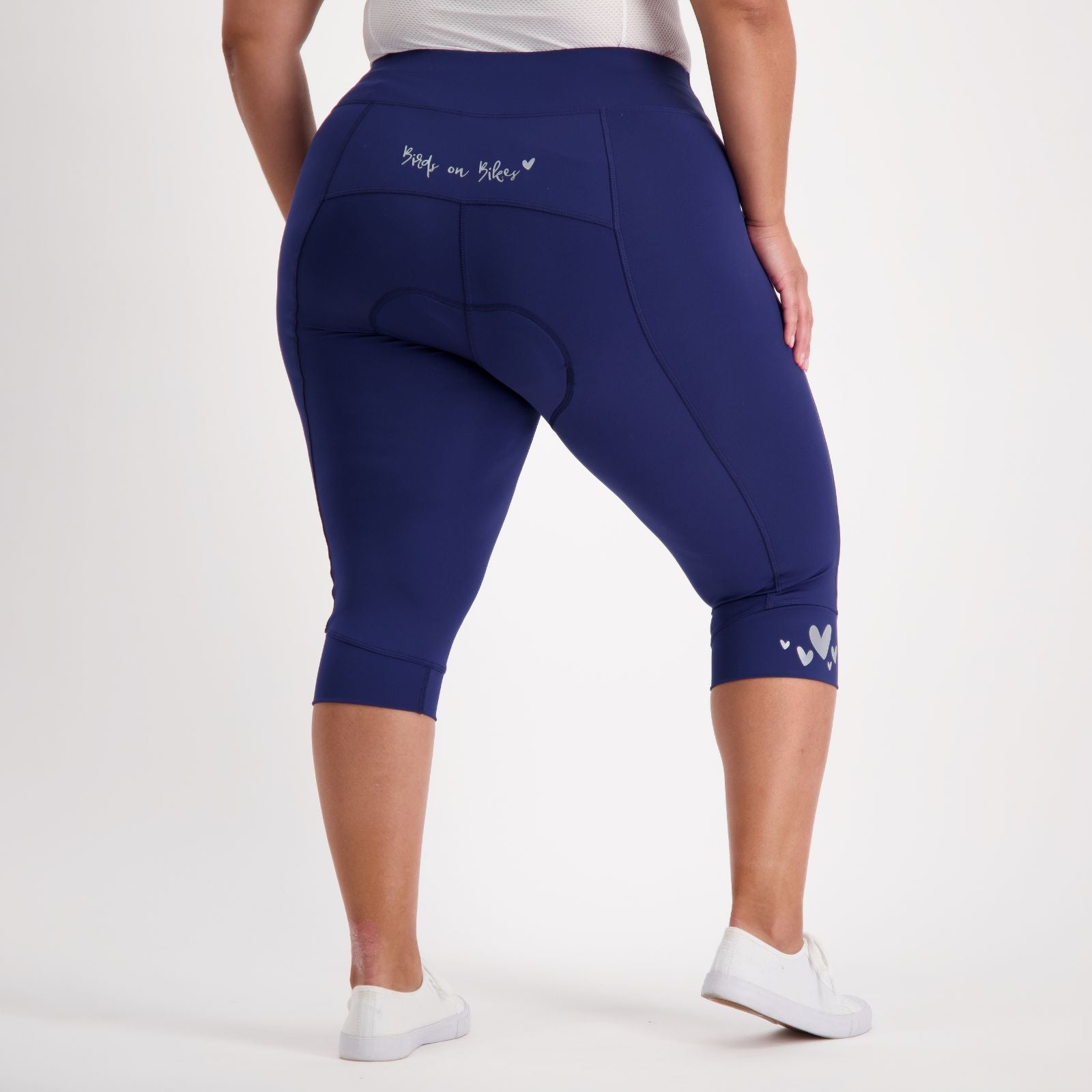 blue womens knee length padded bike pants on a curvy woman