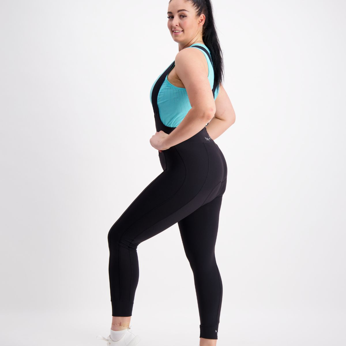 Side view showing seamless inner leg on thermal padded women’s bib tights