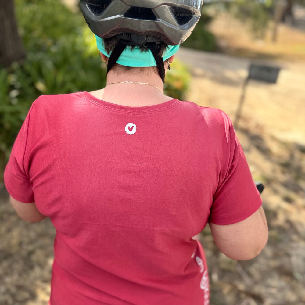 Back view of technical tee, hip‑length cut for layering