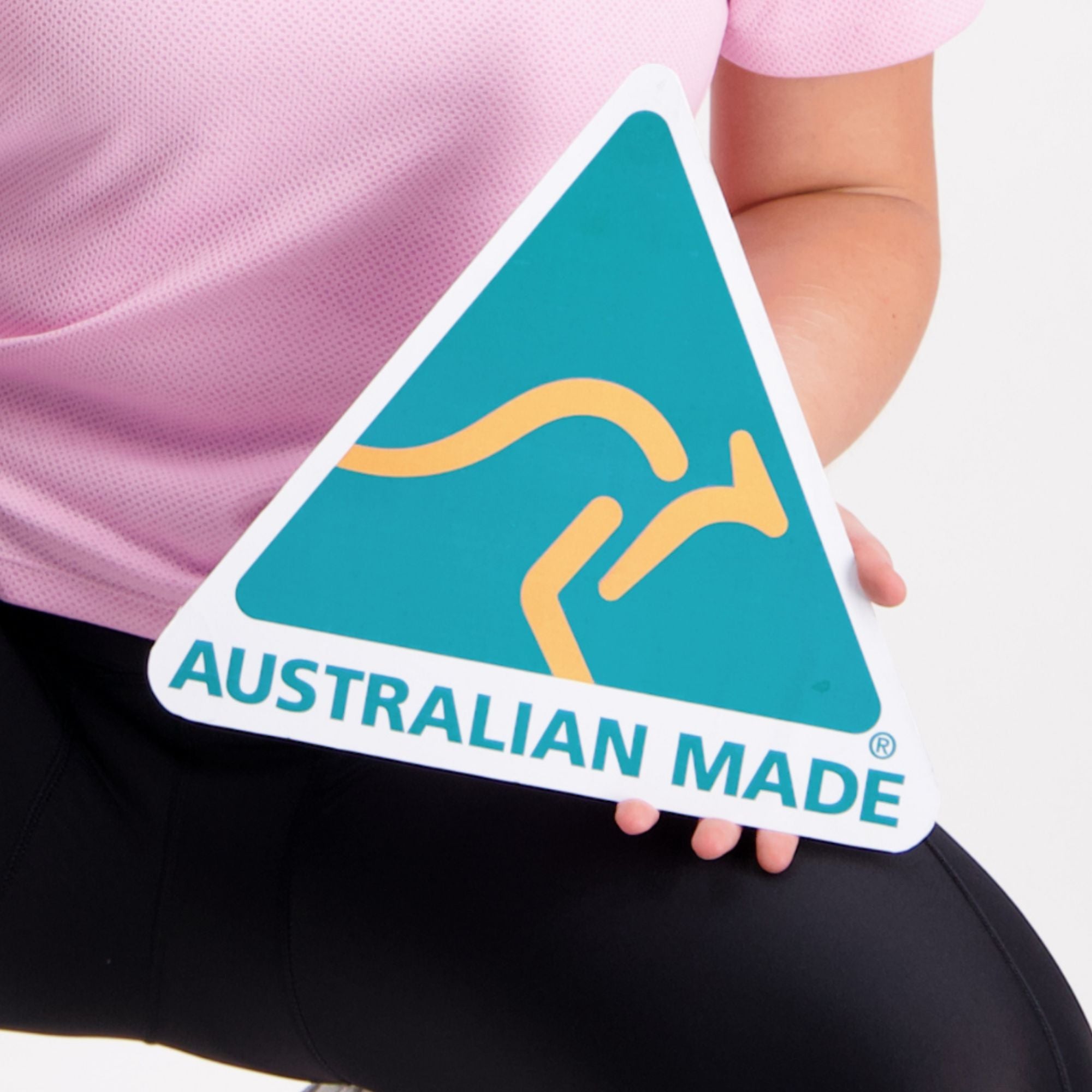 pink cycling top with a green and gold Australian Made sign