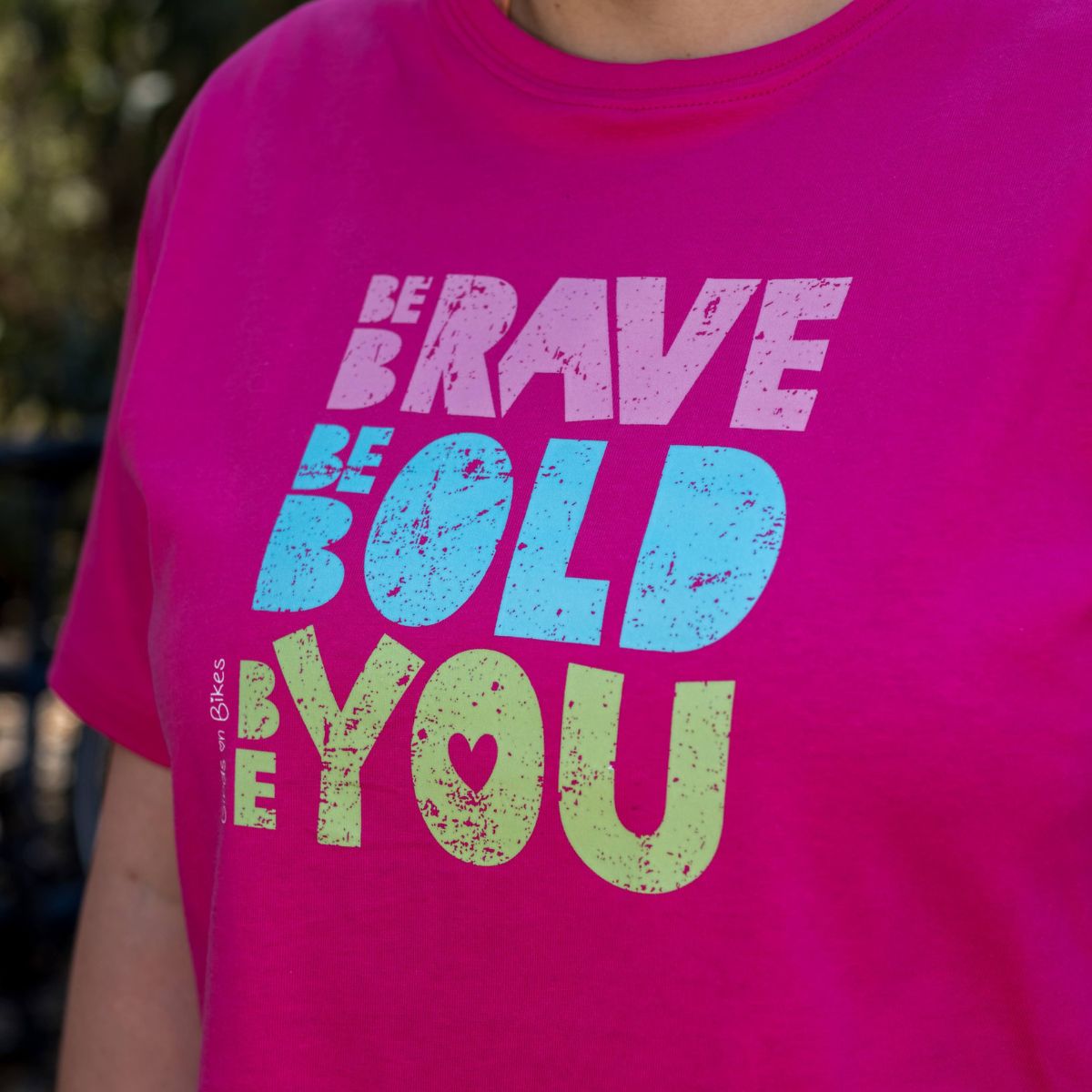 Front view of woman wearing Be Brave. Be Bold. Be You. slogan t-shirt