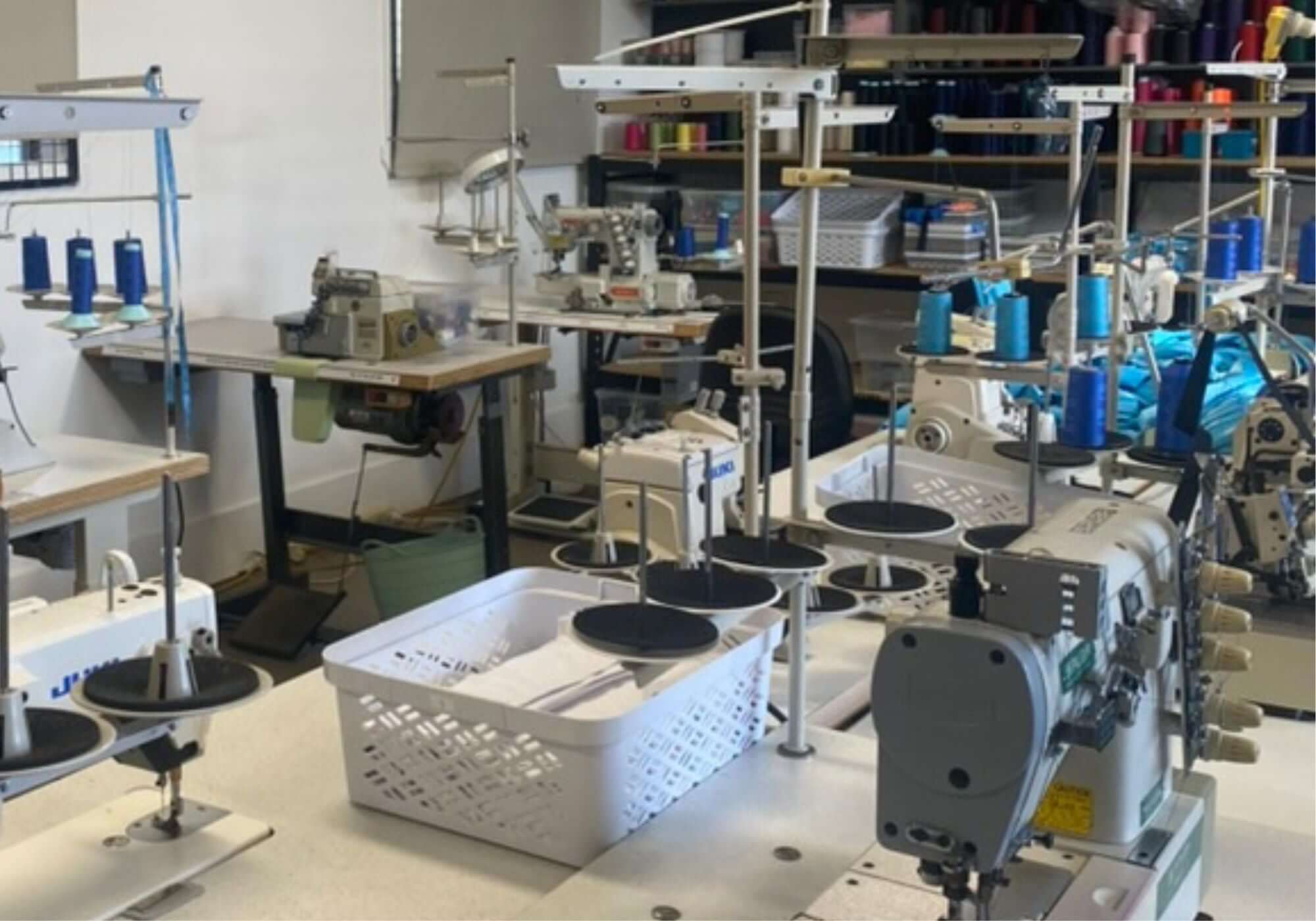 Sewing machine workshop with various machines and equipment.