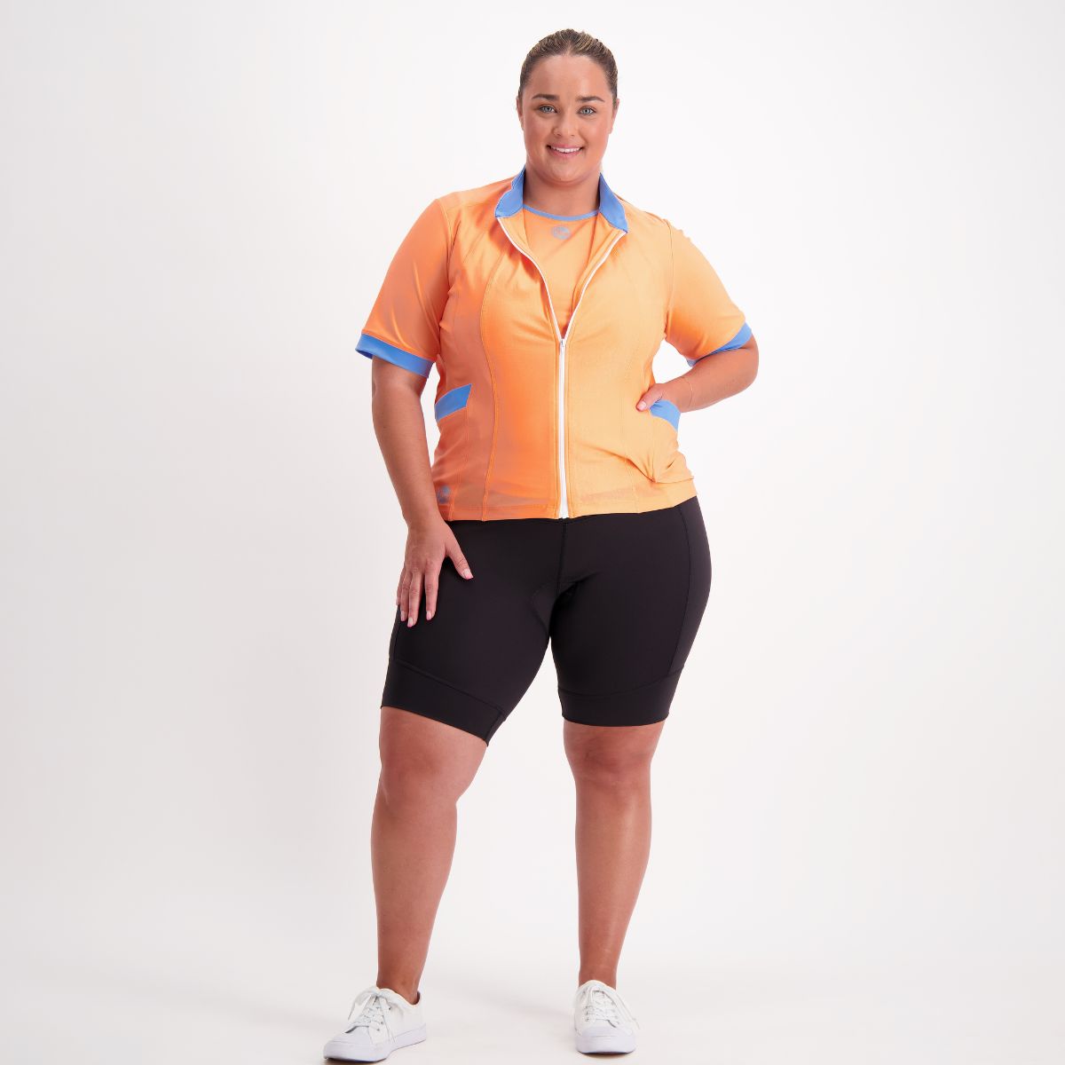 Woman wearing Cruiser Padded Bike Pants – high-waisted, padded cycling shorts.