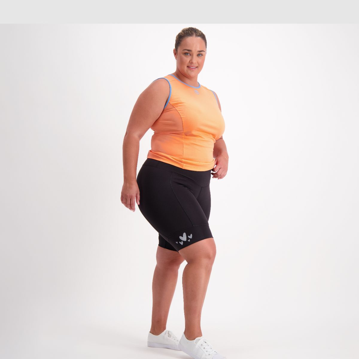 Woman standing in Cruiser Padded Bike Pants – comfortable, padded, and secure fit.
