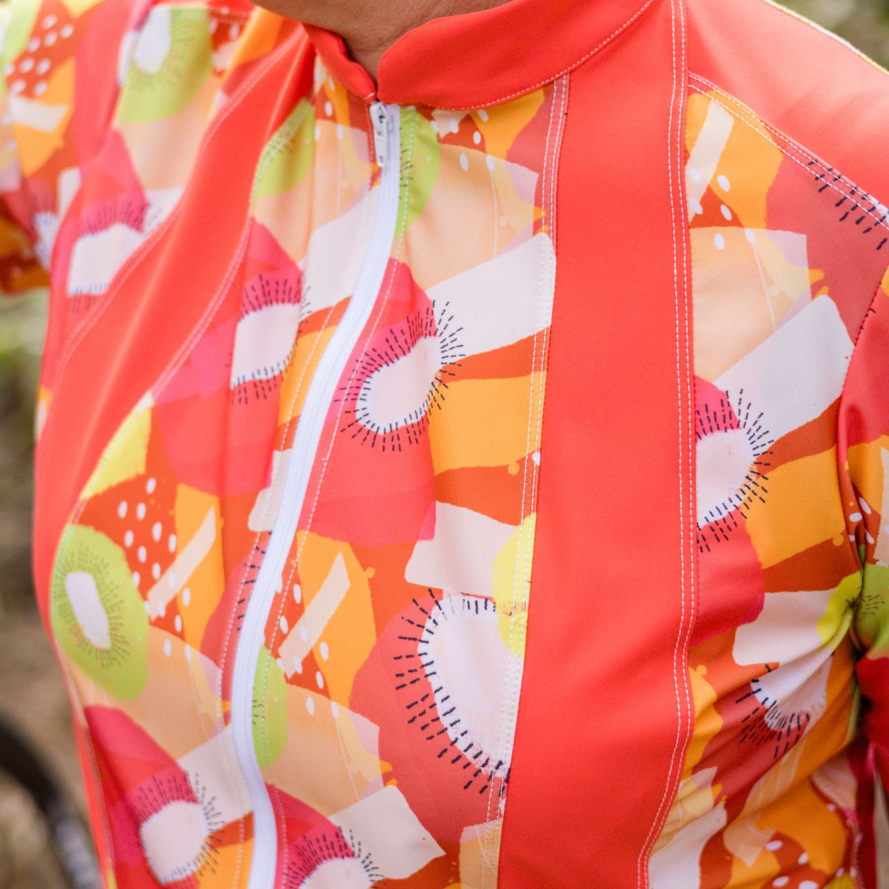 womens cycling jersey tutti fruity orange print front panels