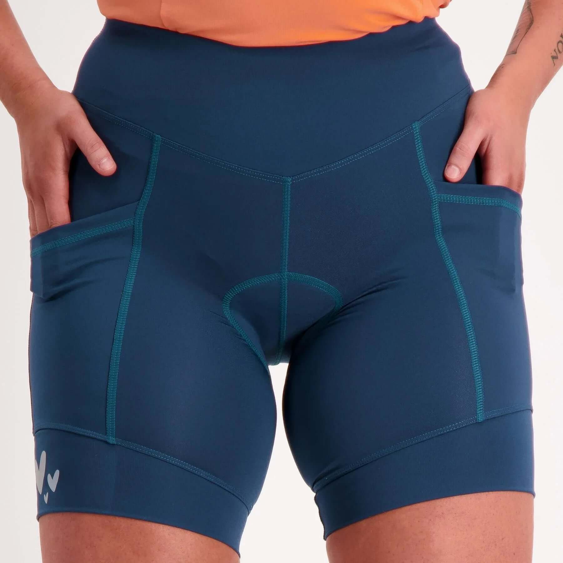 Women's pocket padded bike shorts forest worn by cyclist, front view