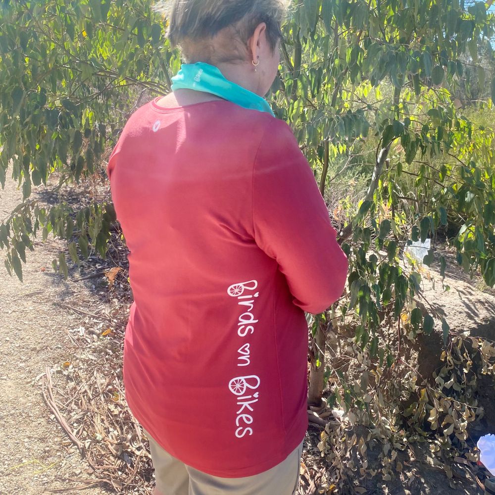 Back view of women’s long sleeve technical tee, hip‑length cut