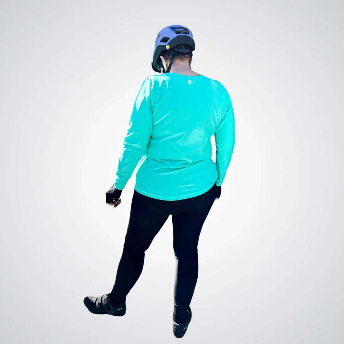 Padded thermal cycling tights worn by cyclist, back view