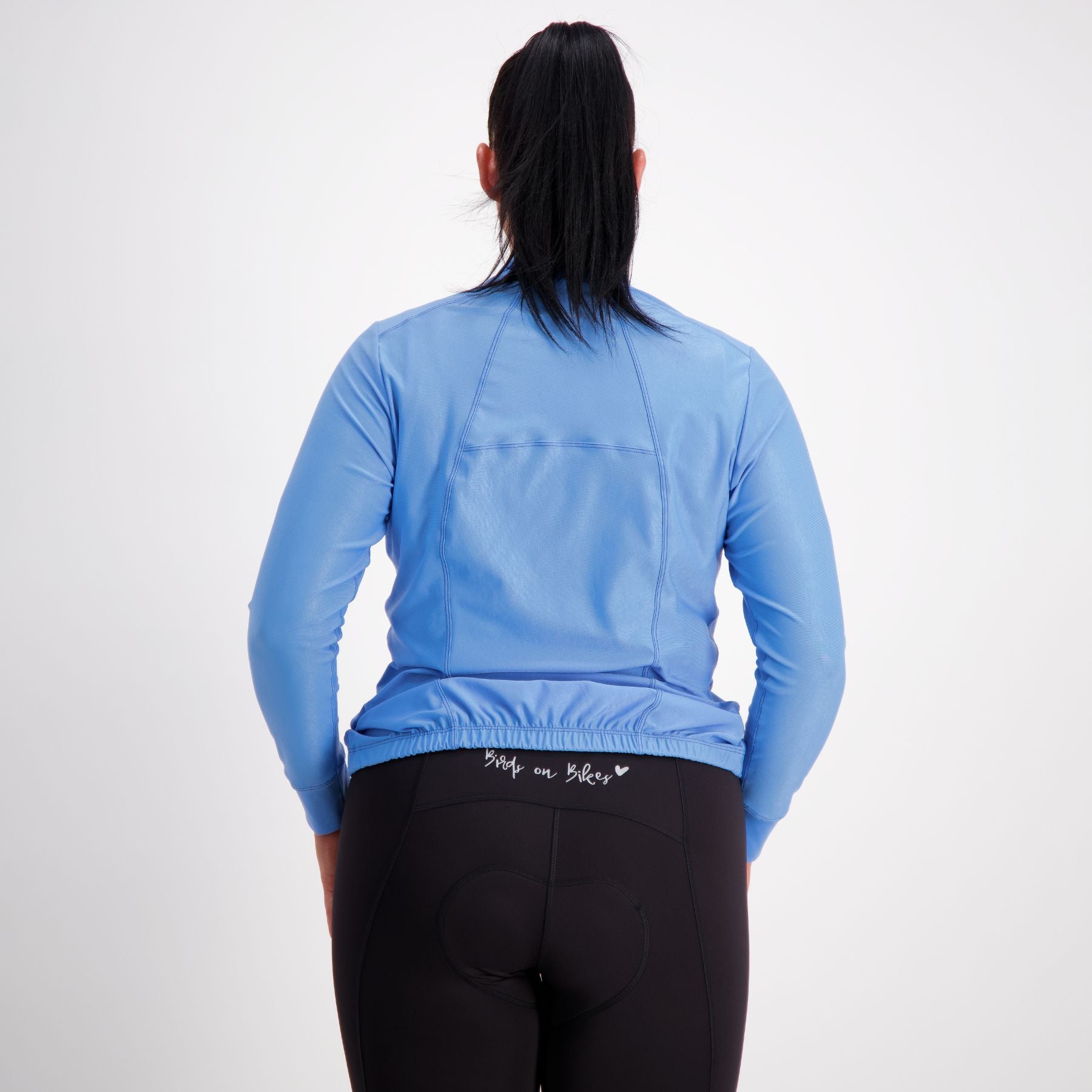 back view of long sleeve womens cycling jersey in azure blue 