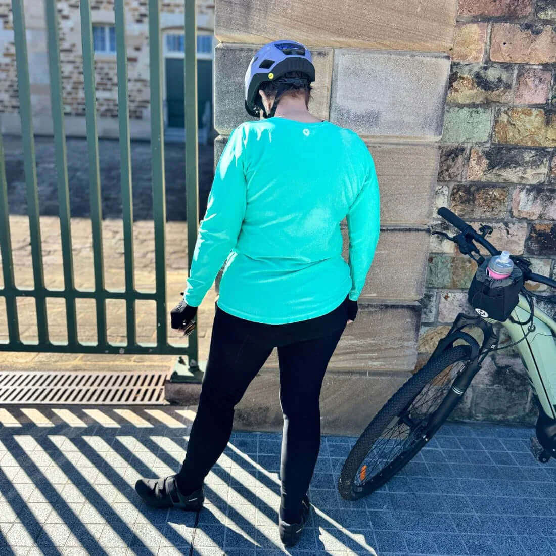 Woman cycling in Birds on Bikes padded thermal cycling tights