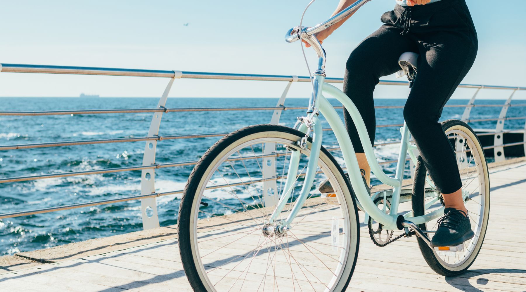 cyclists riding along coast in australia