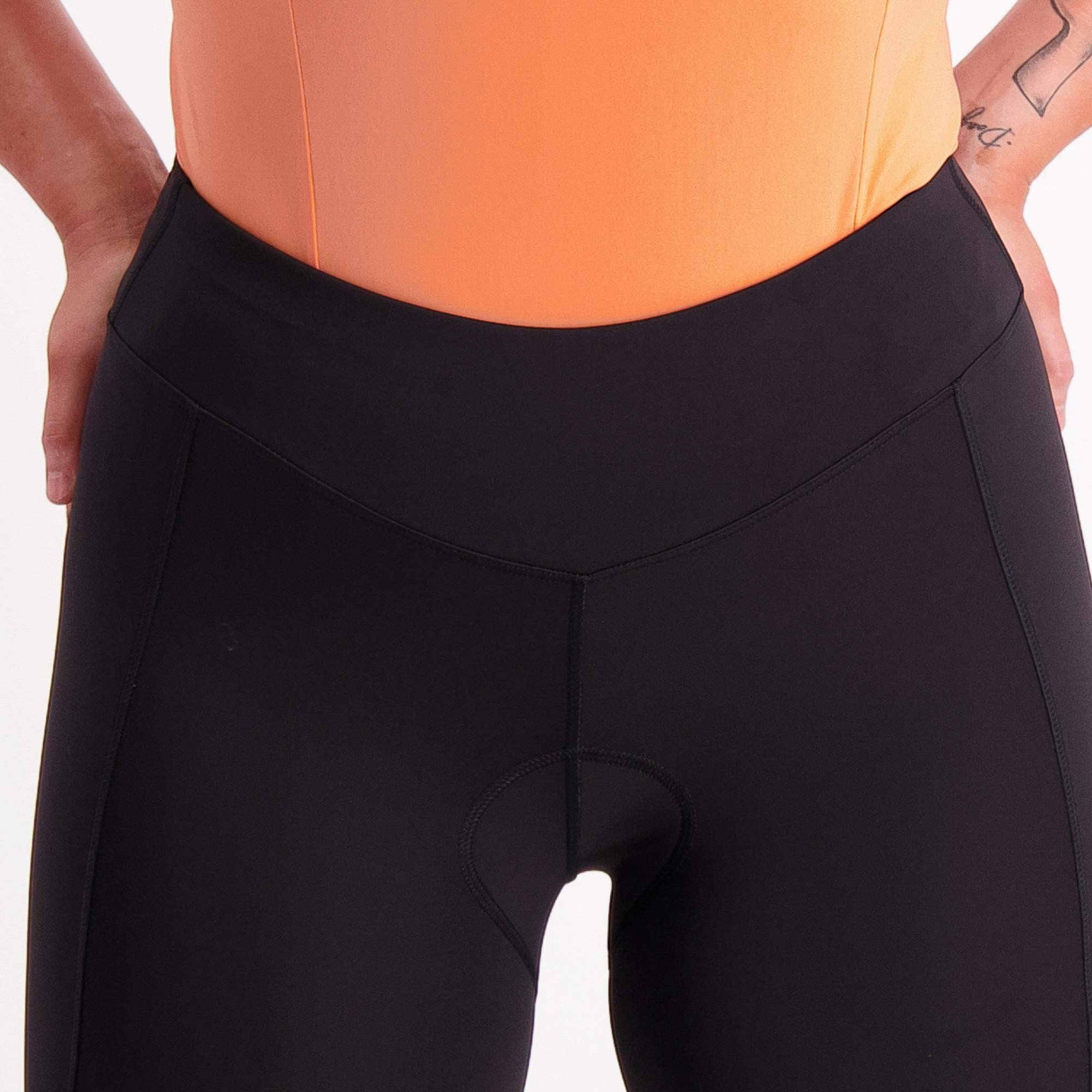 close up of high waistband on black 3/4 length padded bike pants