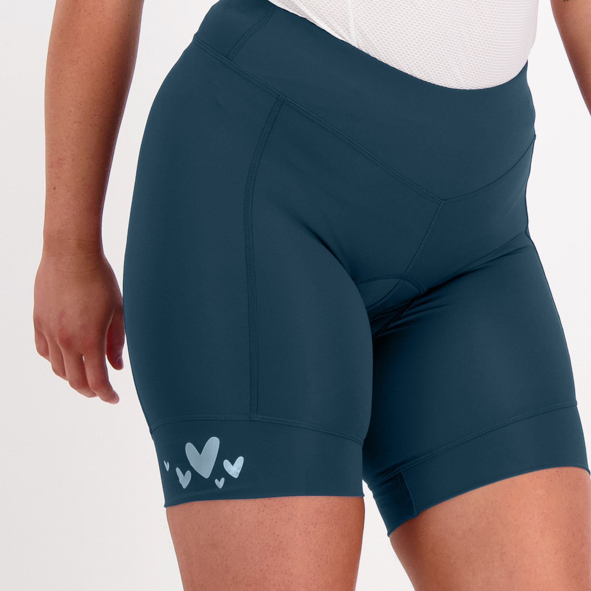 Navy forest green padded bike shorts with heart reflective on a white background