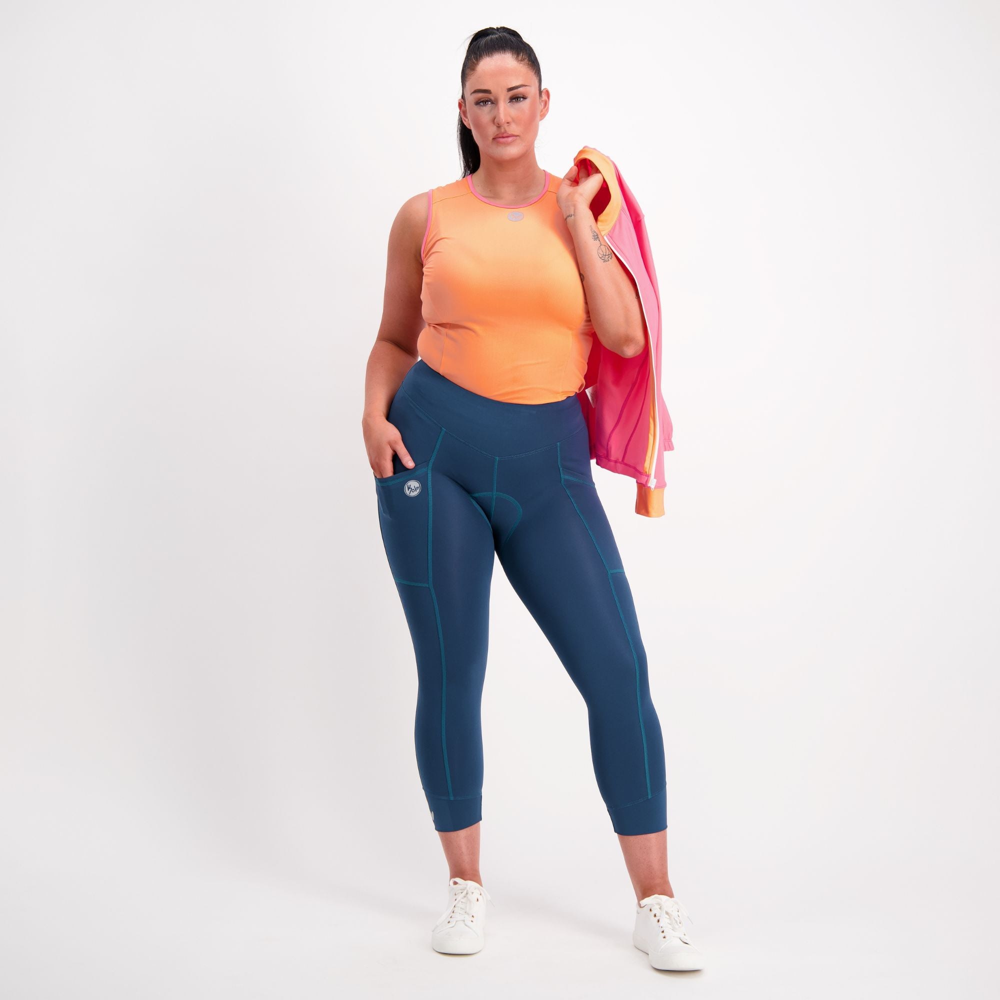 Full body view of Orange with pink trim sleeveless Cycling Base Layer on female model