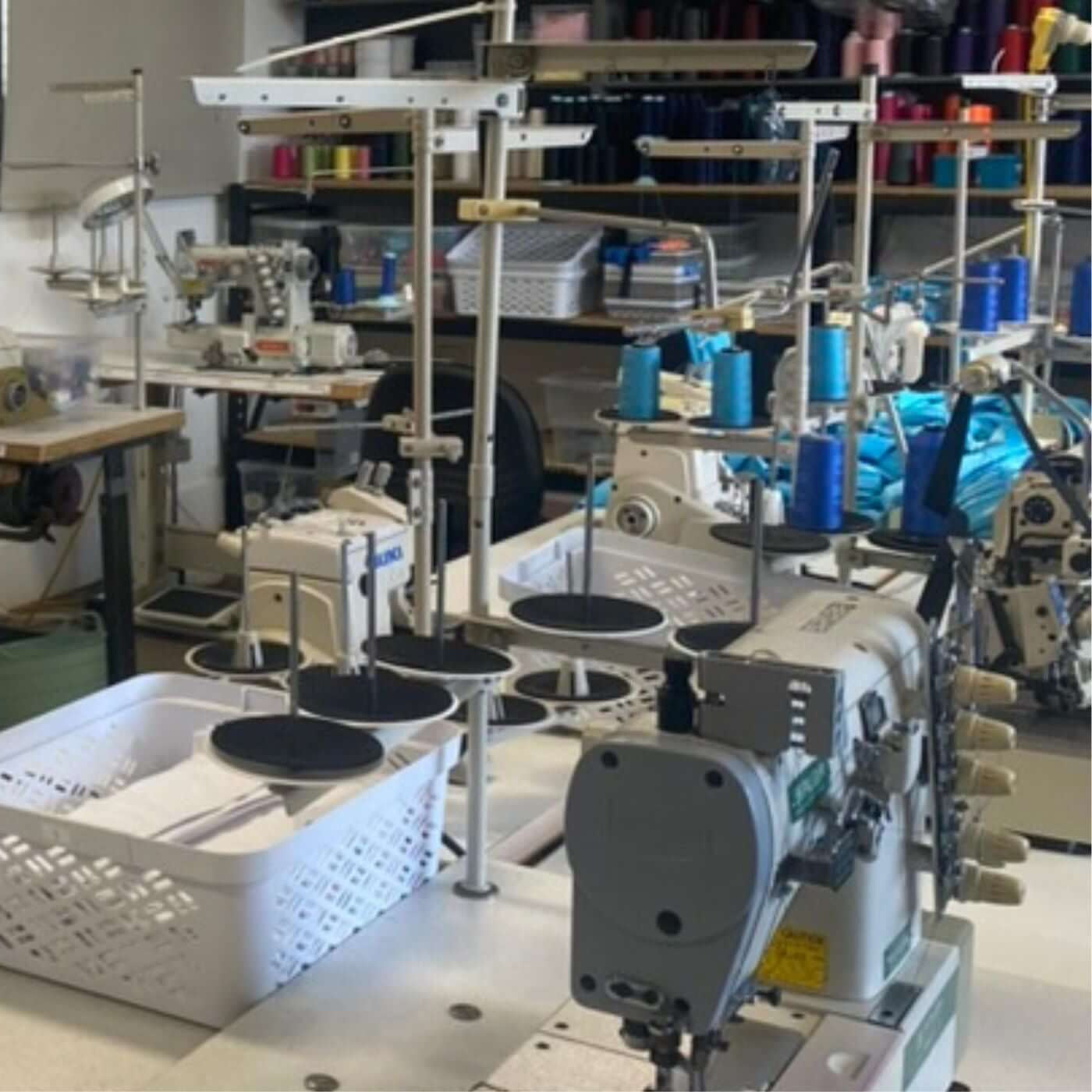 Sewing machine workshop with various machines and equipment.
