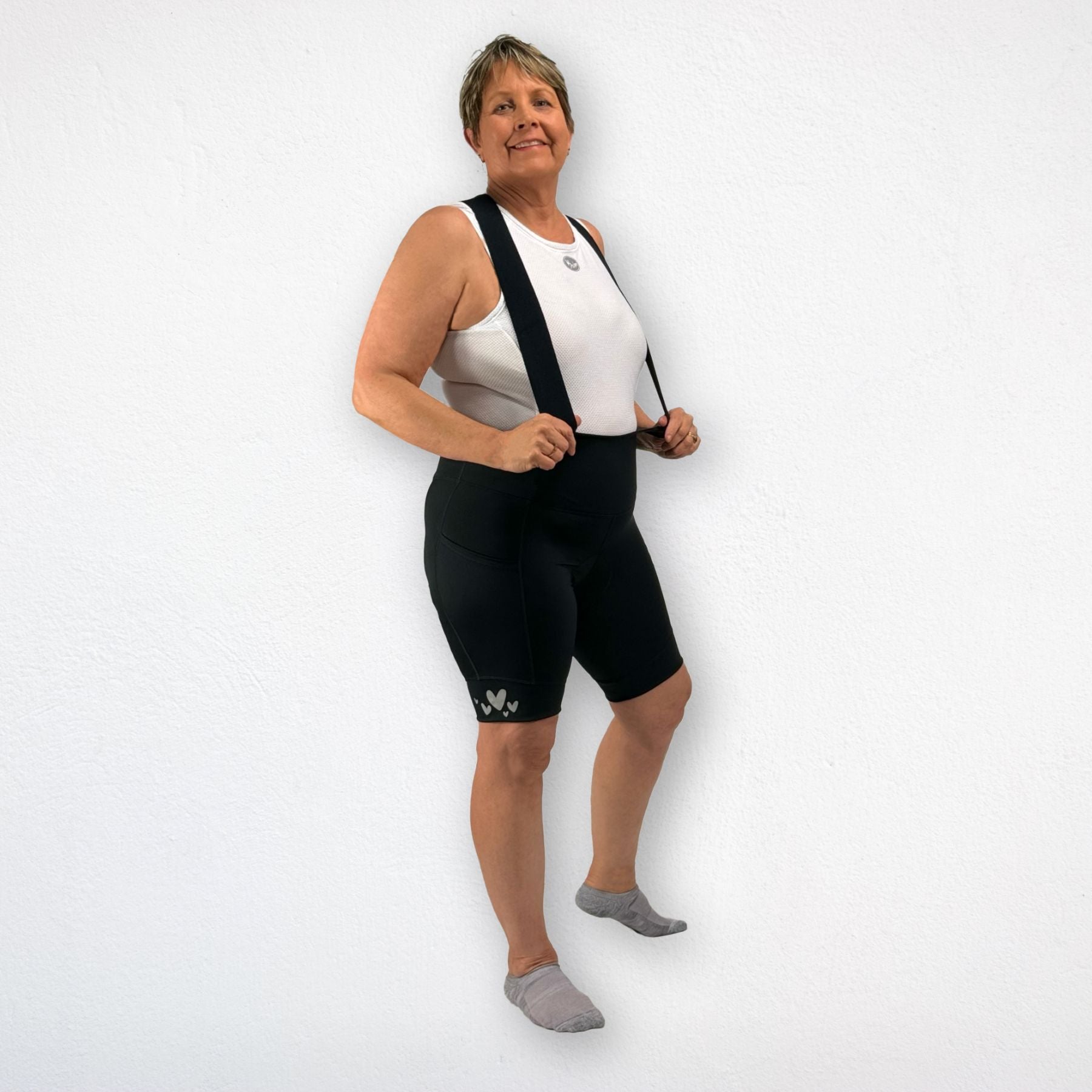 Woman cycling in Power Pocket Bib Shorts – breathable, padded, and designed for maximum comfort.