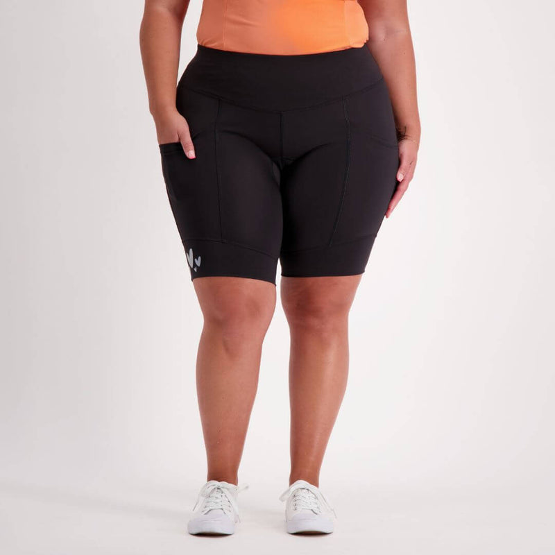 Person wearing black bike pants padded on a white background