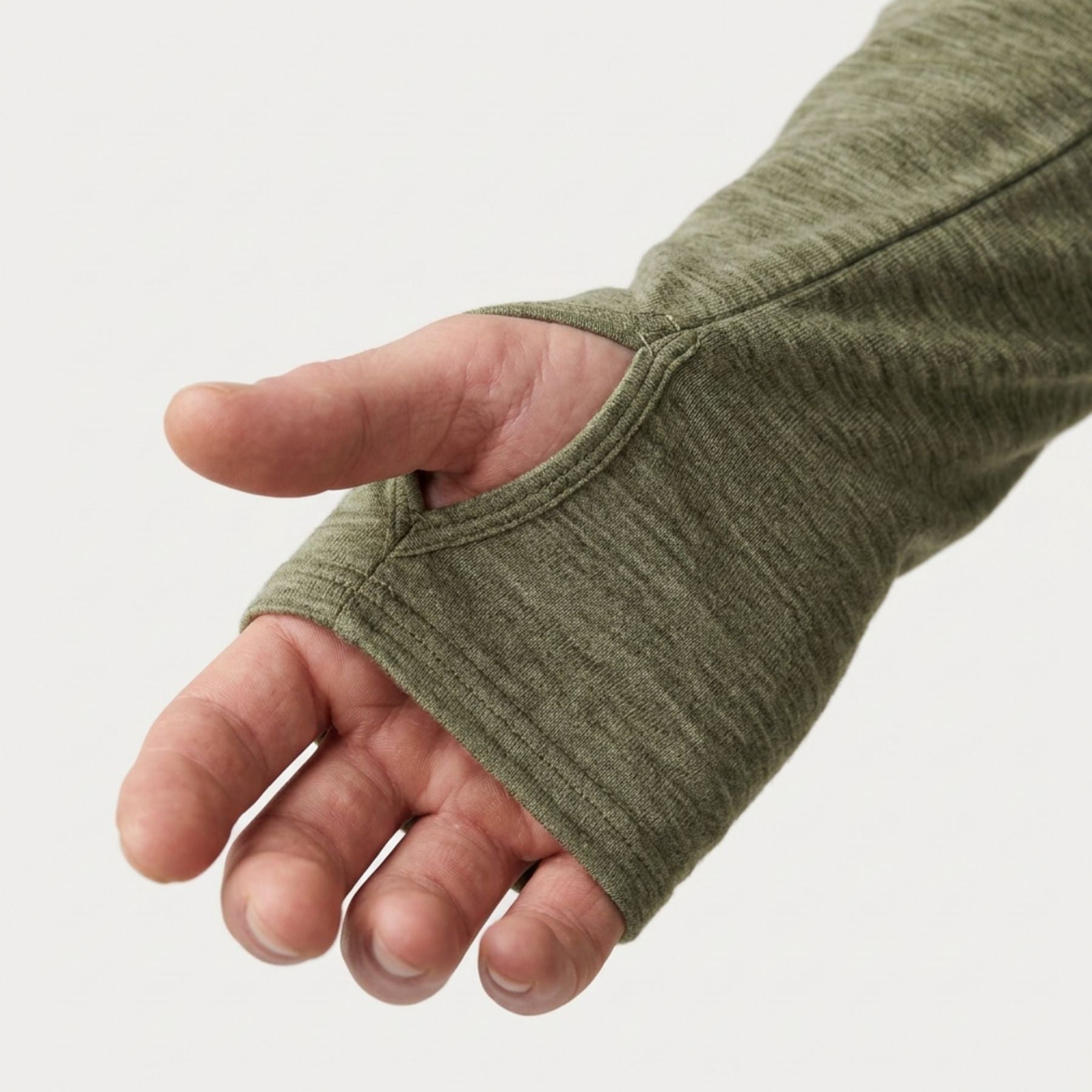 A close-up of a person's hand wearing an olive green fingerless knit glove or sleeve, shown against a plain light gray background.